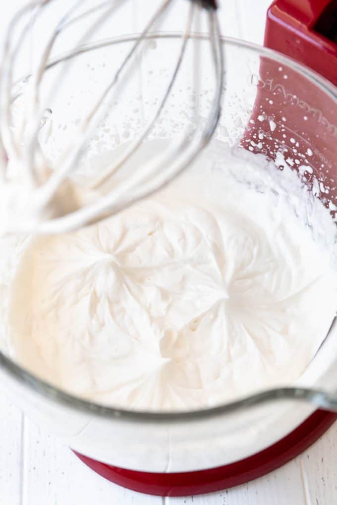 whipped cream in the bowl of a stand mixer