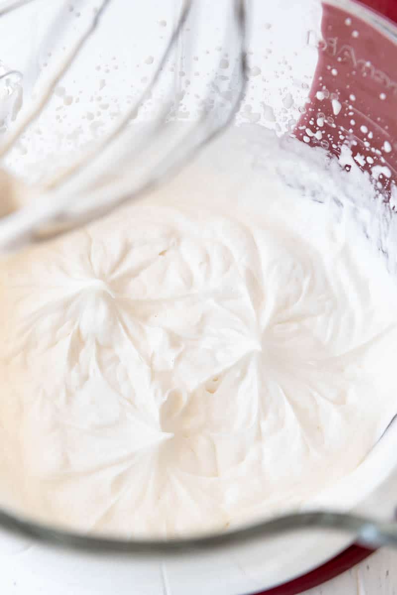 a close image of sweetened whipped cream with soft peaks