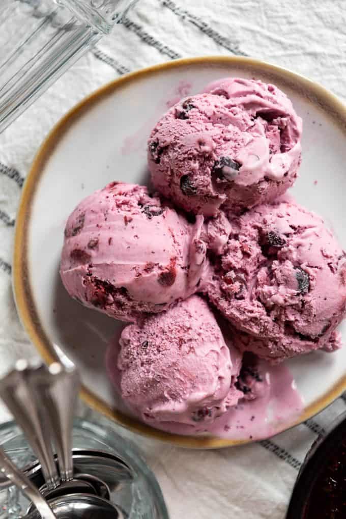 scoops of purple homemade huckleberry ice cream made with wild Montana huckleberries 