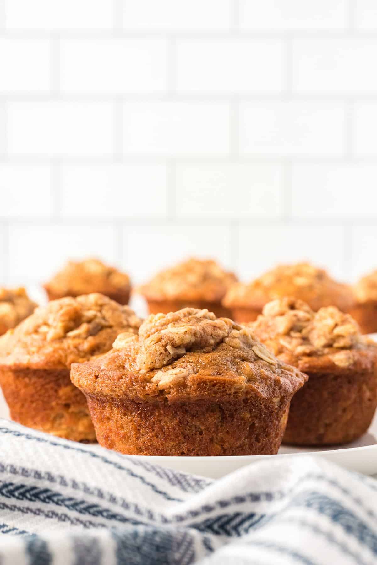 apple oatmeal muffins on a white plate.