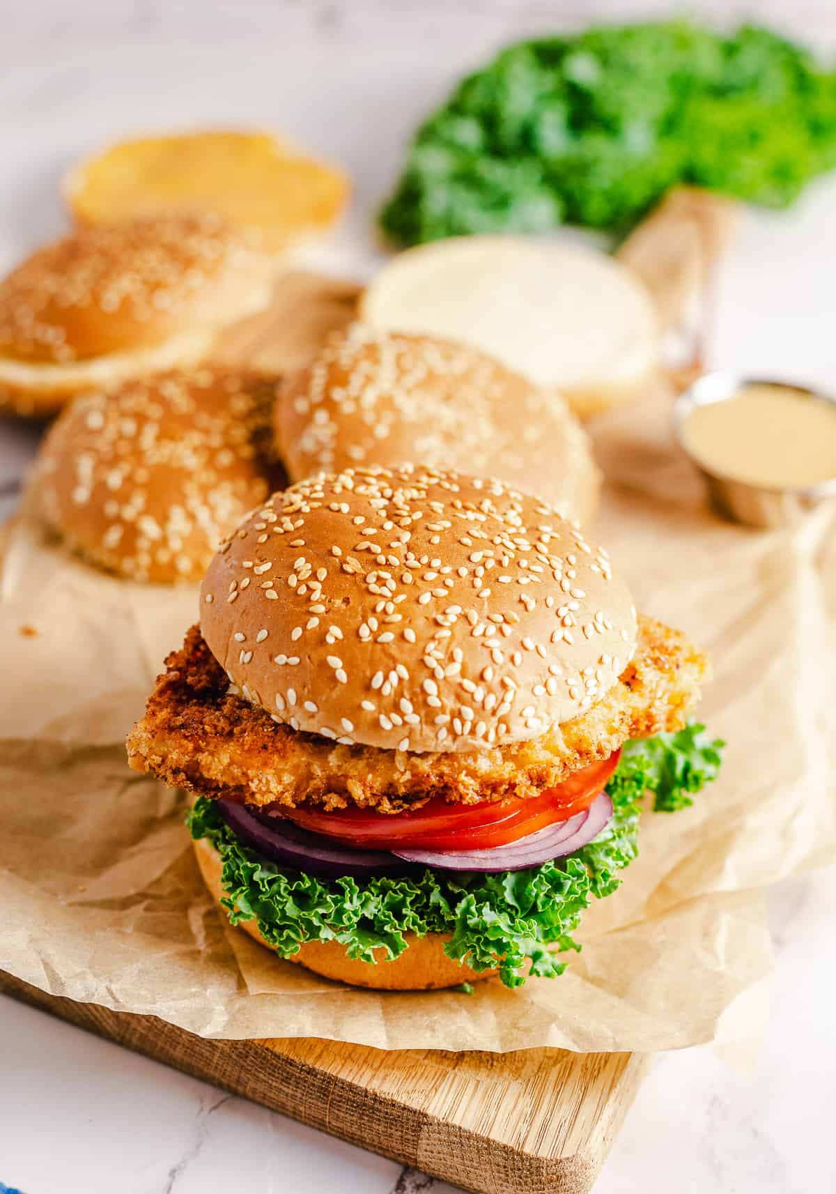 A crispy buttermilk chicken sandwich on a sesame seed bun.