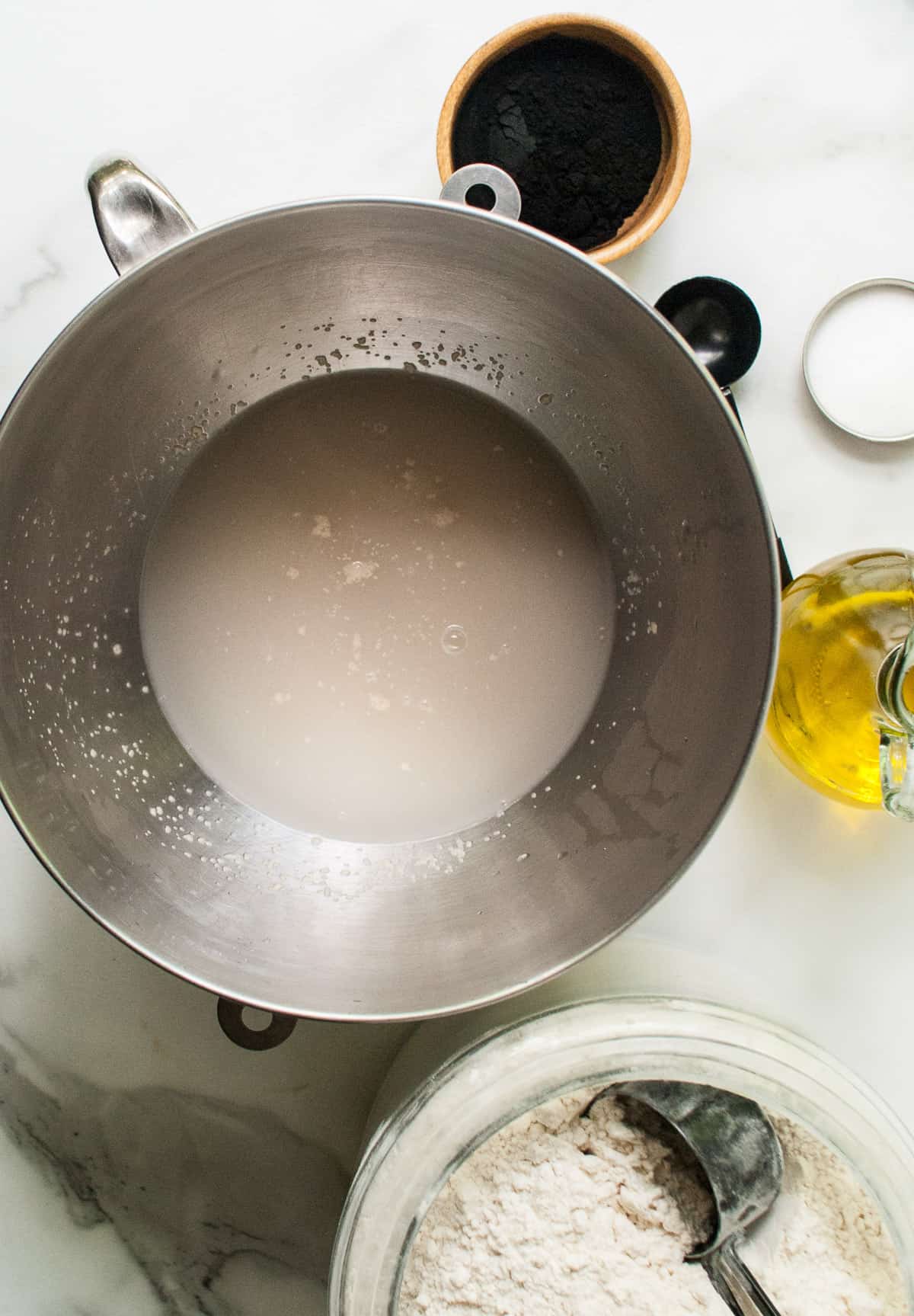 Proofing yeast in a bowl of warm water.