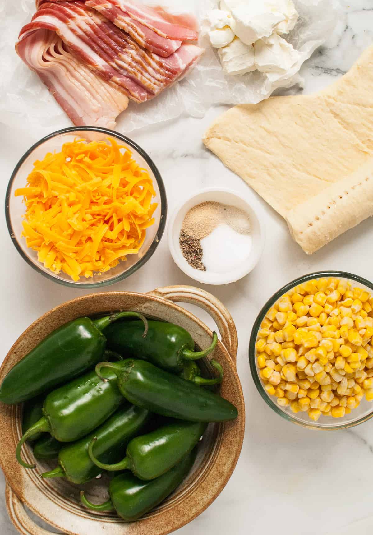 Ingredients for making Halloween jalapeno poppers that look like mummies.