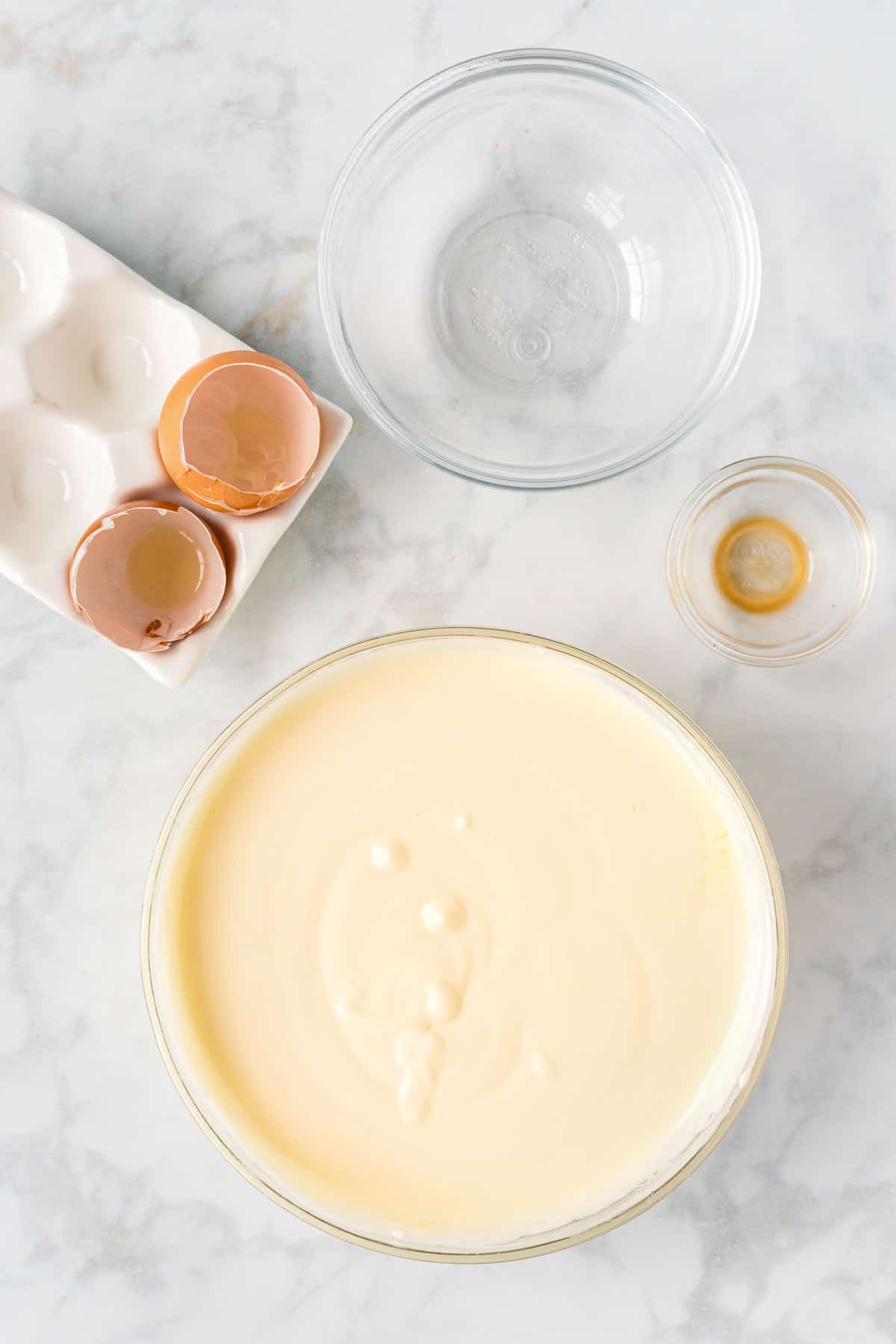 Cheesecake filling in a large bowl.