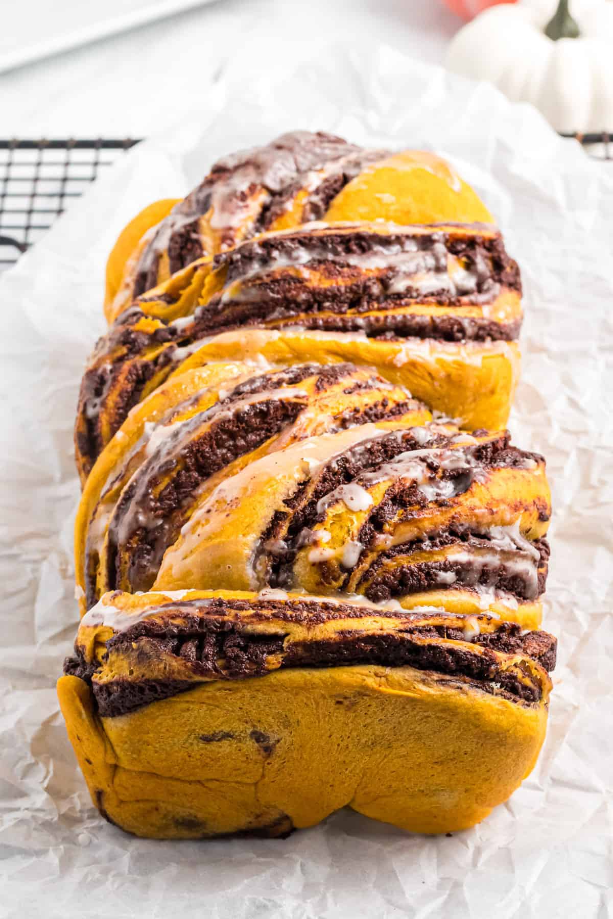 a loaf of homemade pumpkin babka swirled with chocolate.