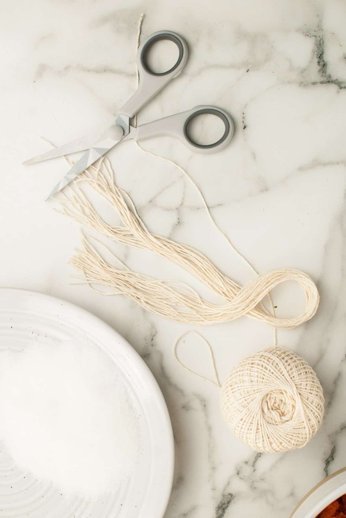 Scissors and kitchen twine are displayed. 