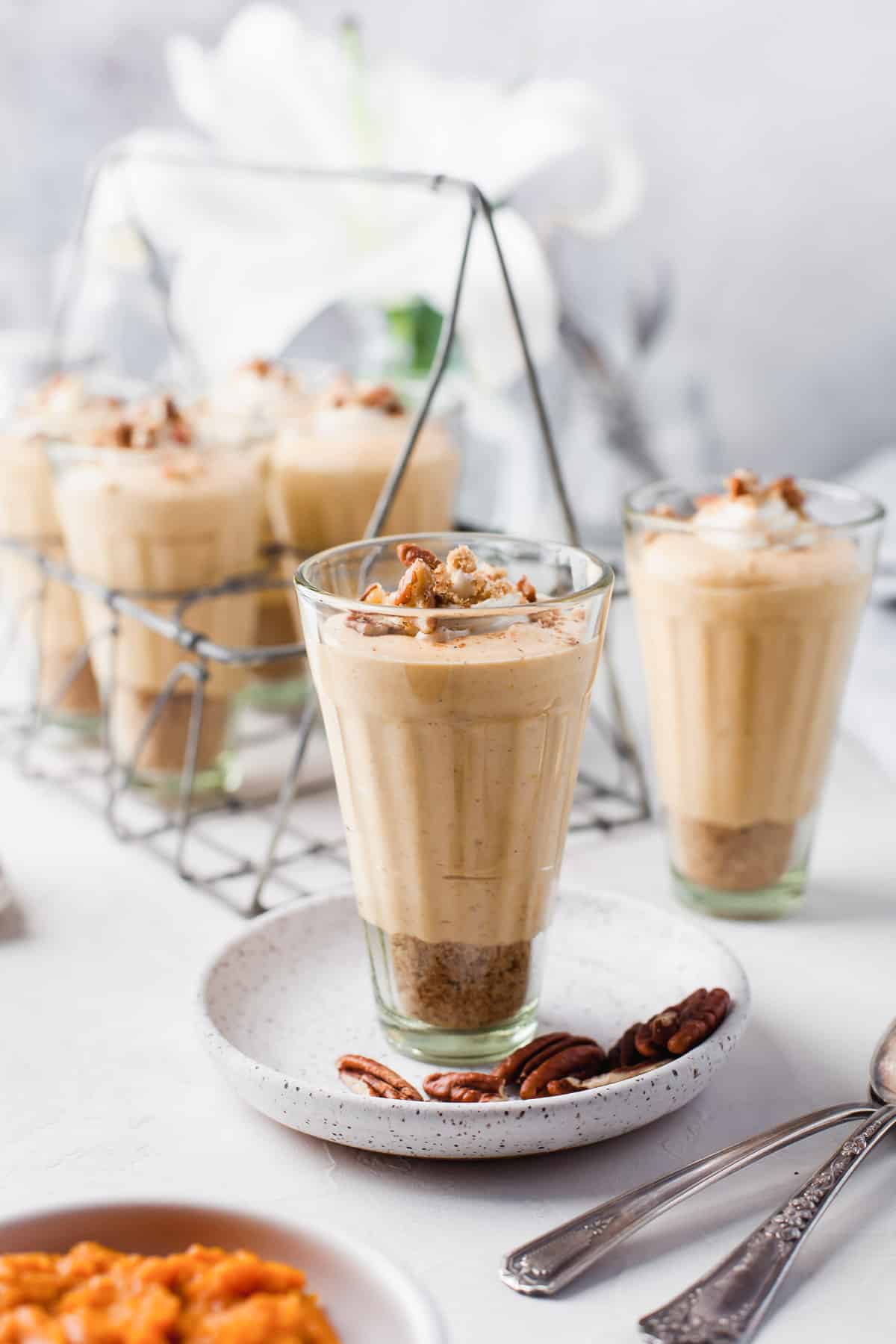 Individual dessert cups filled with creamy pumpkin mousse.