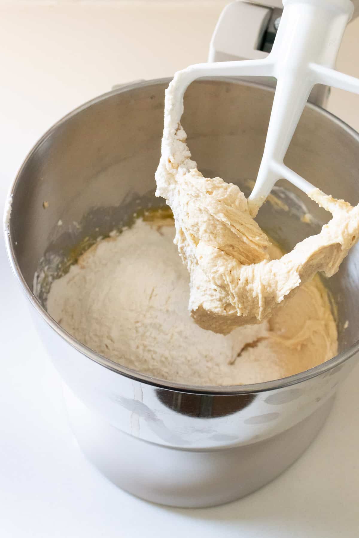 Four and other dry ingredients are added to the peanut butter dough. 