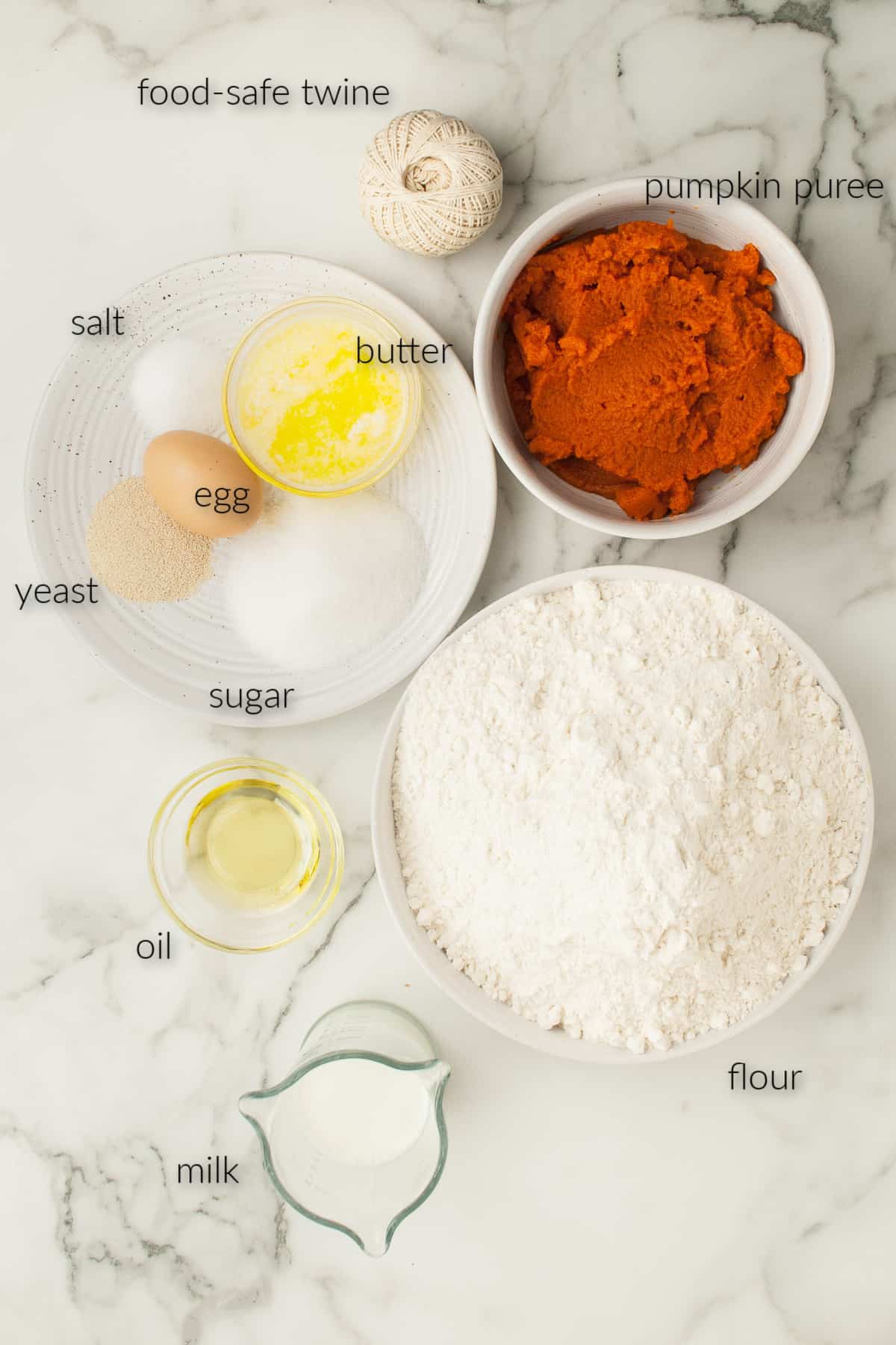 labeled ingredients for making pumpkin shaped rolls.