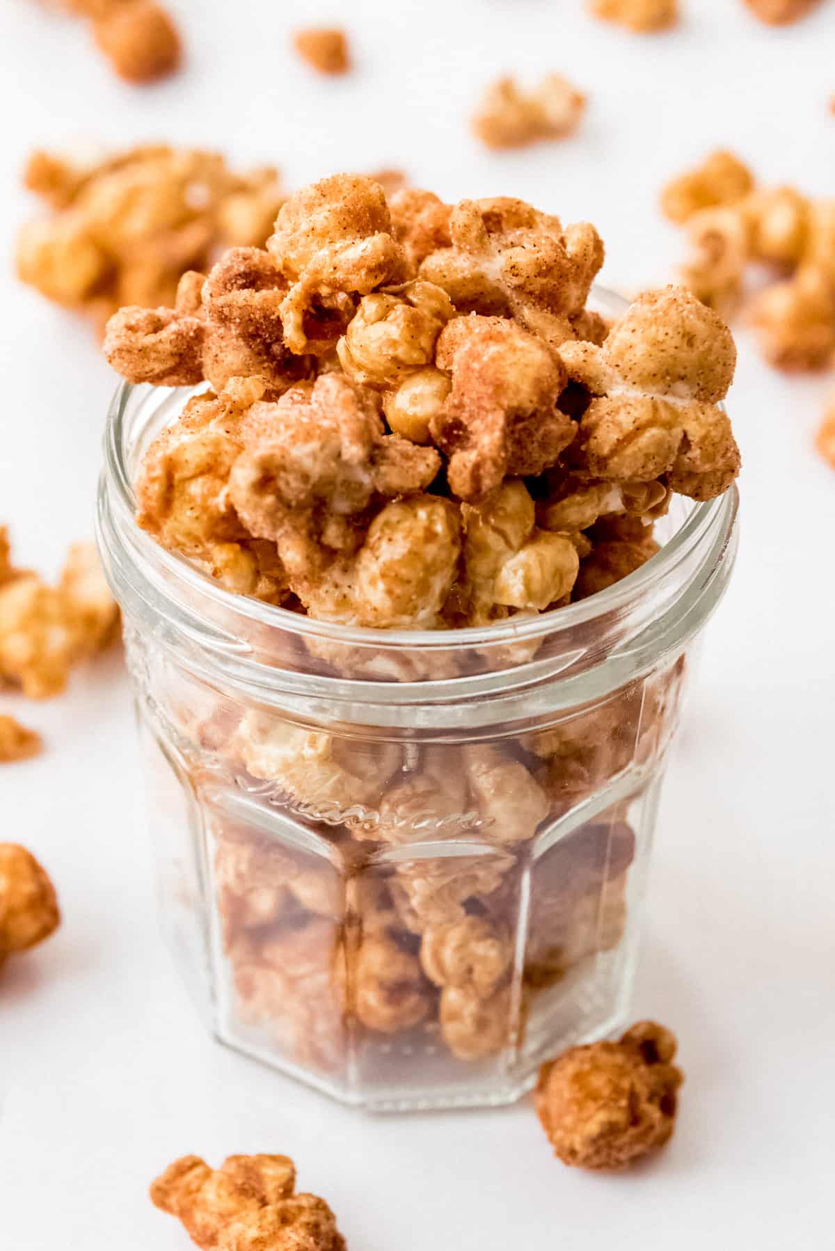 Close up of churro popcorn piled high in a jar. 