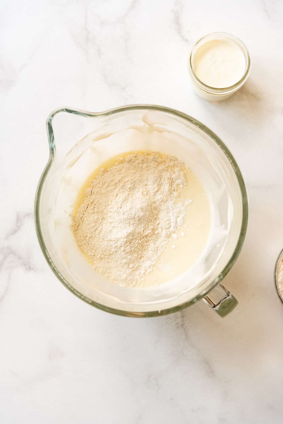 Adding dry ingredients to cake batter.