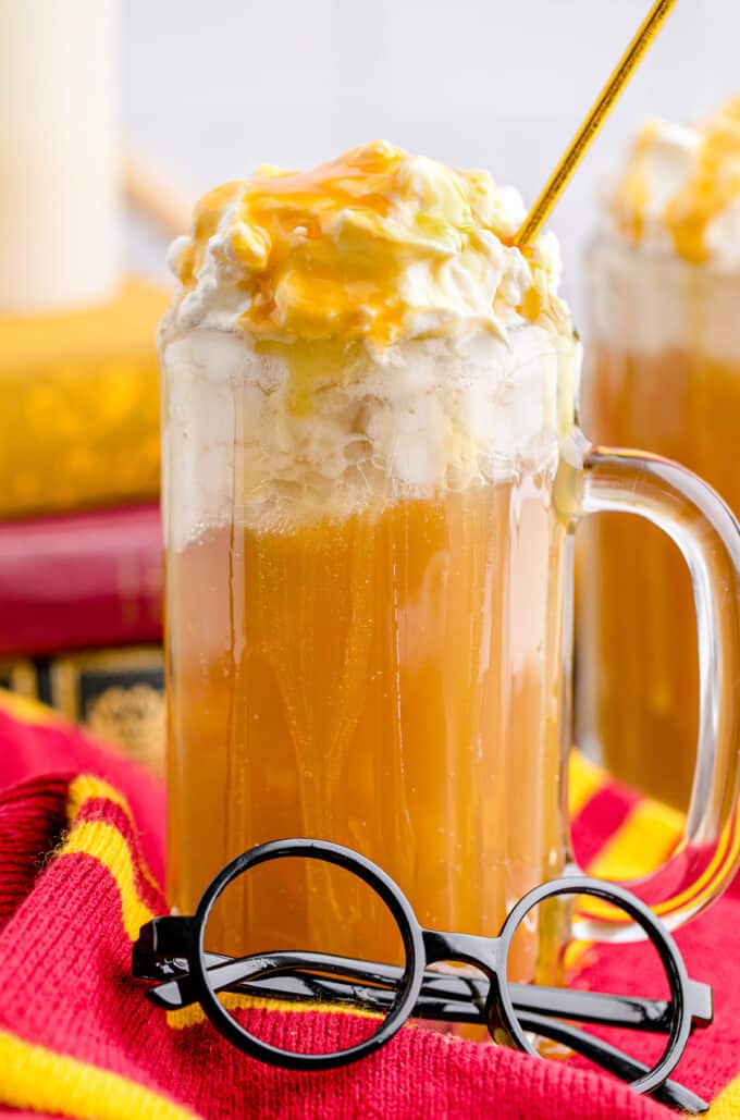 A tall mug of homemade butterbeer.