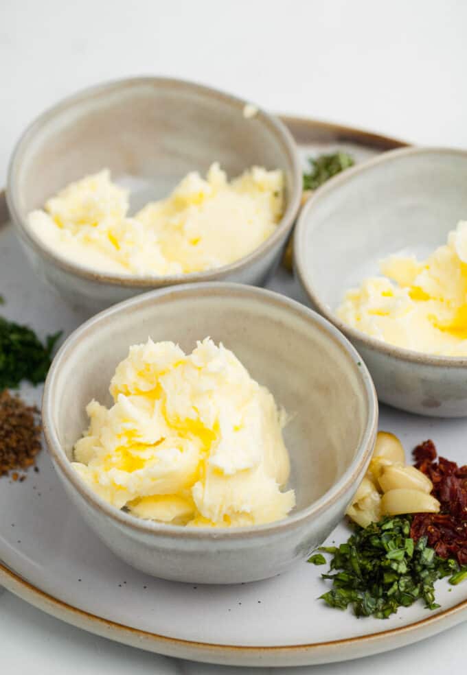 Butter divided into bowls for flavoring.