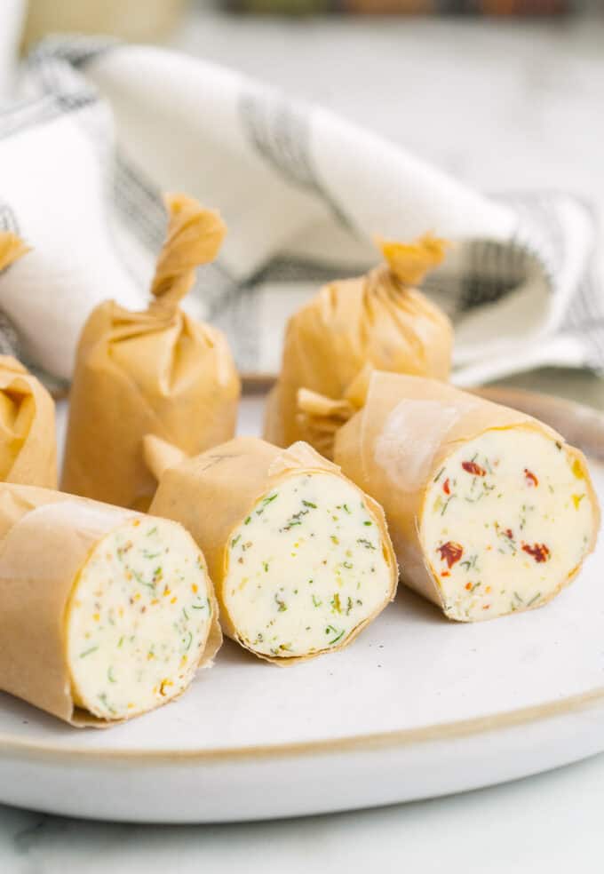 Compound butter flavors rolled in parchment paper.