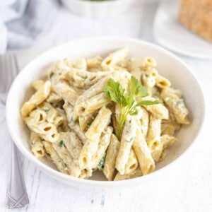 A bowl of Instant Pot Penne Alfredo Pasta.