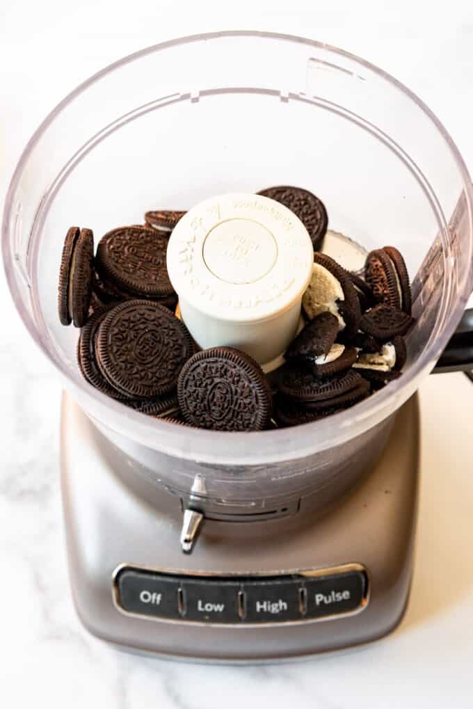 Oreos in a food processor to be ground up for a pie crust.