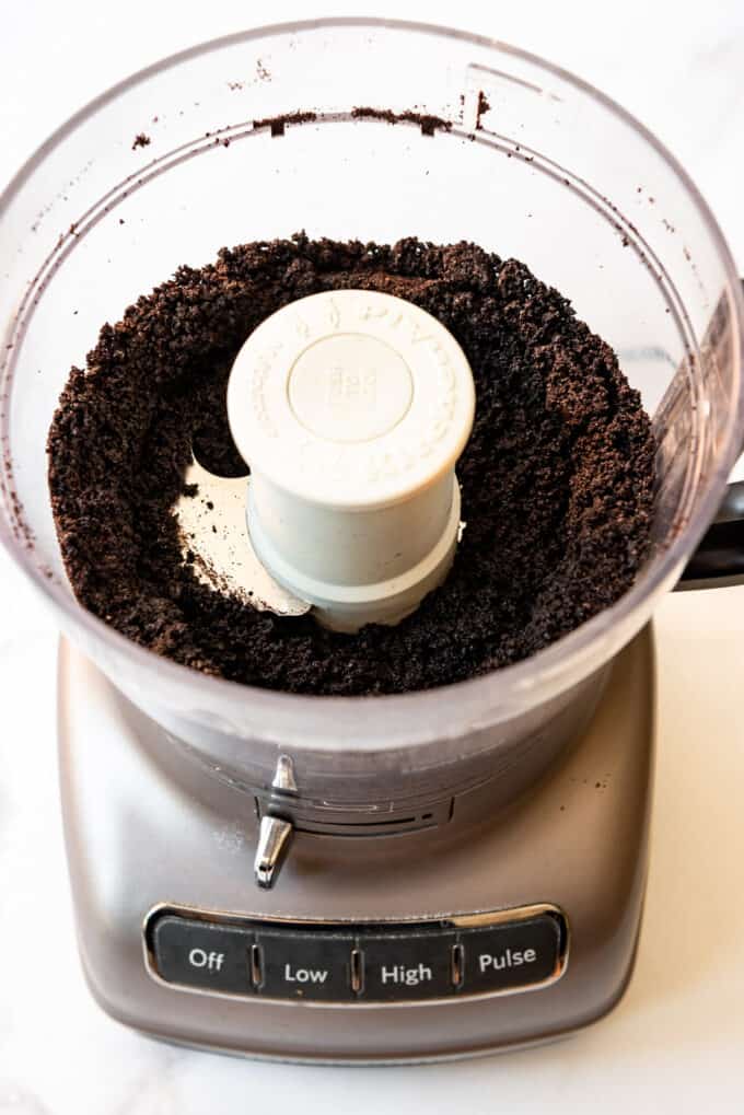 Finely ground Oreo cookie crumbs in a food processor.