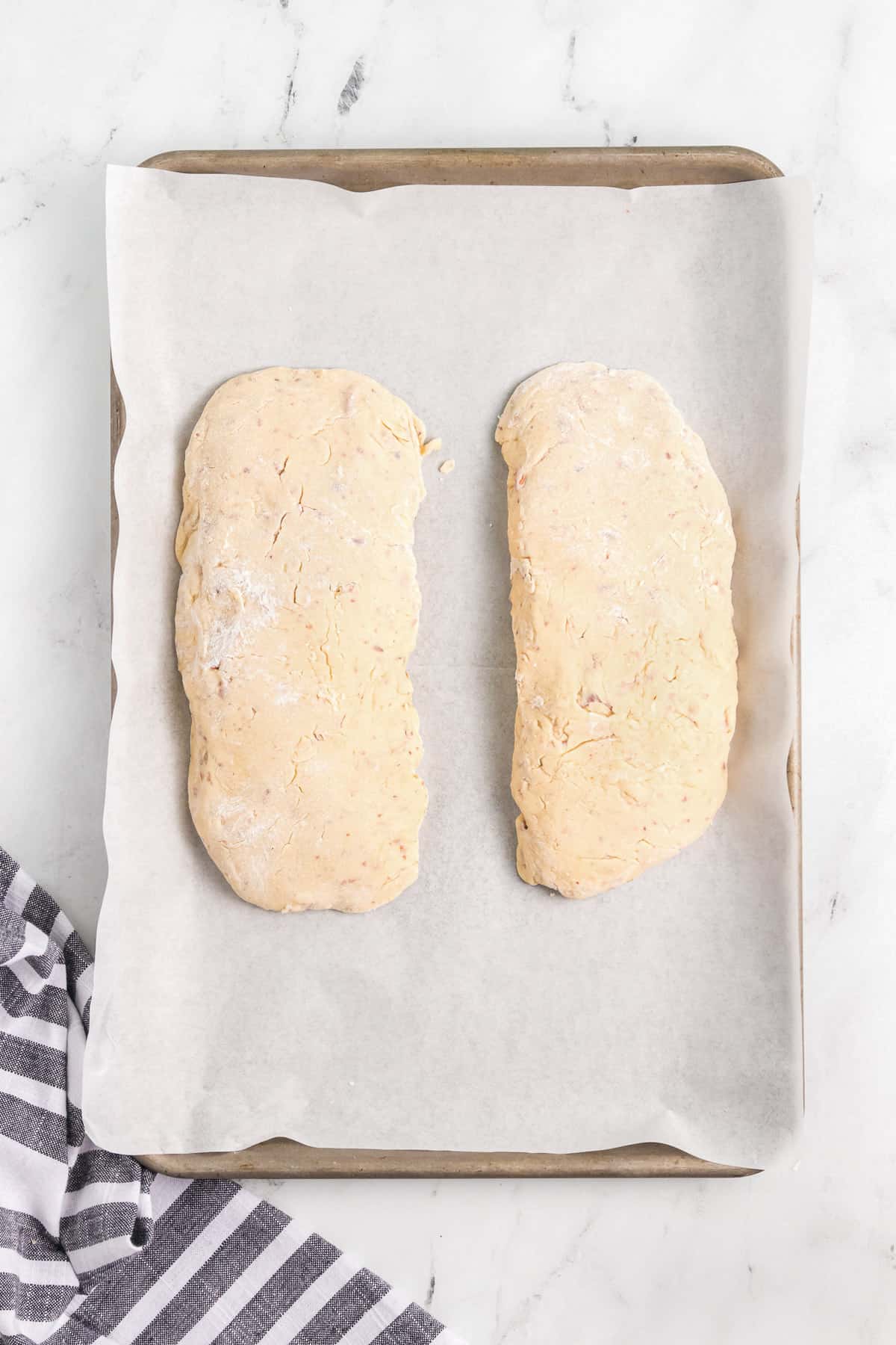 First shaping and baking of almond biscotti dough.