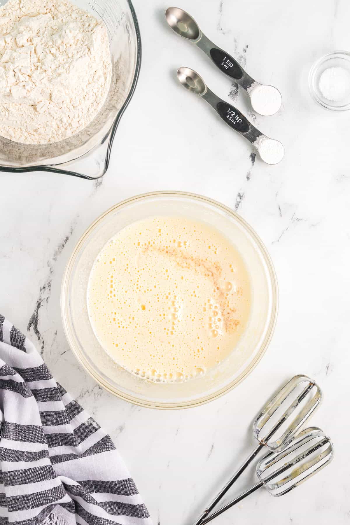 Beaten eggs and sugar in a mixing bowl until thick.