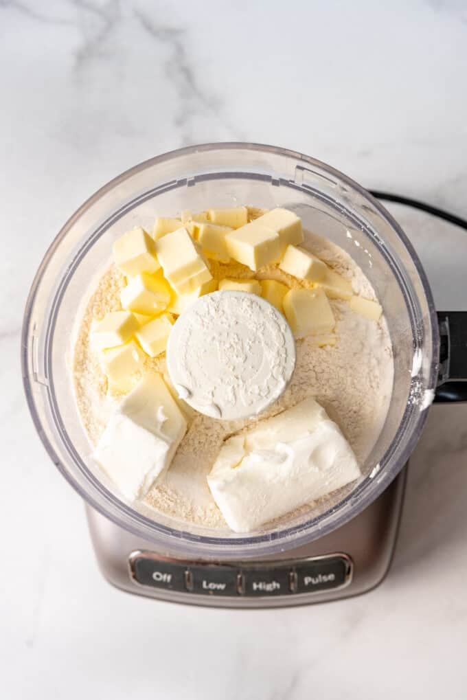 Making pastry dough in a food processor with flour, butter, and shortening.