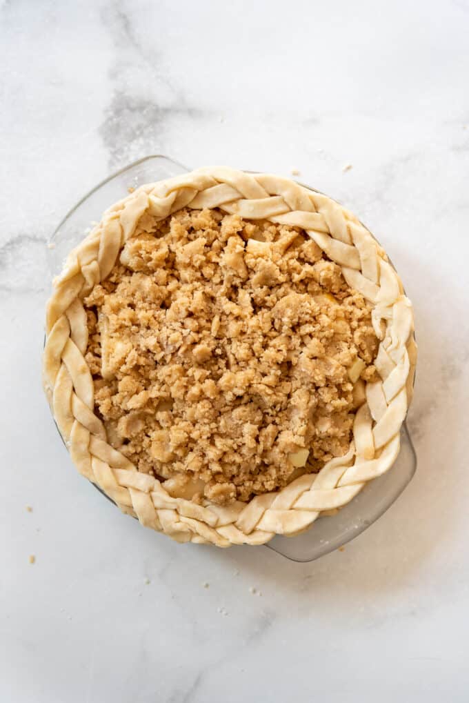 An unbaked pear pie with streusel topping.