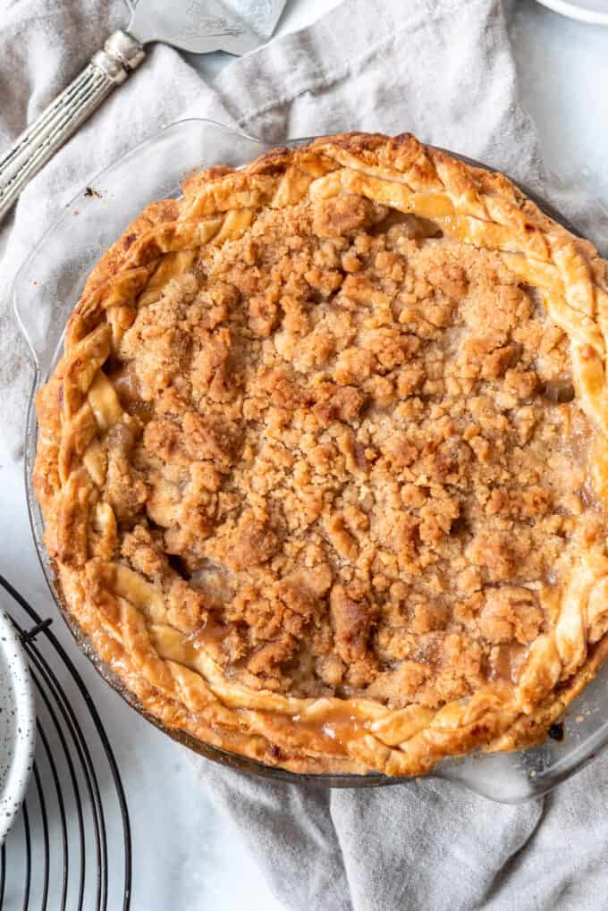 A homemade pear pie with a braided pie crust border around the edge.