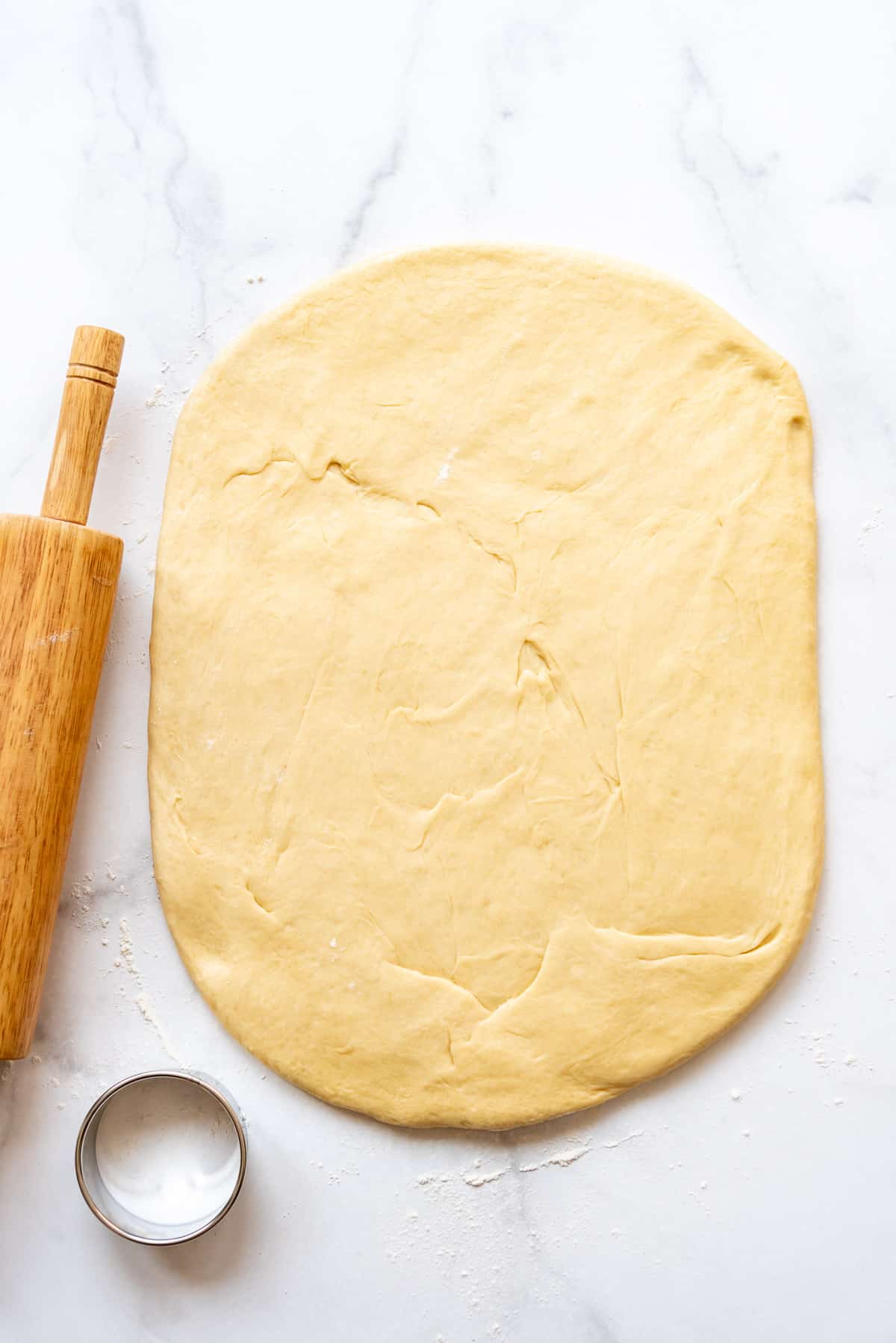 Rolling out enriched yeast dough.