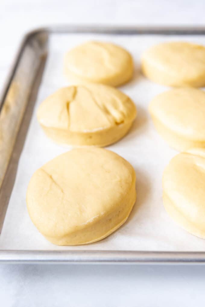 Circles of packzi dough on a baking sheet.