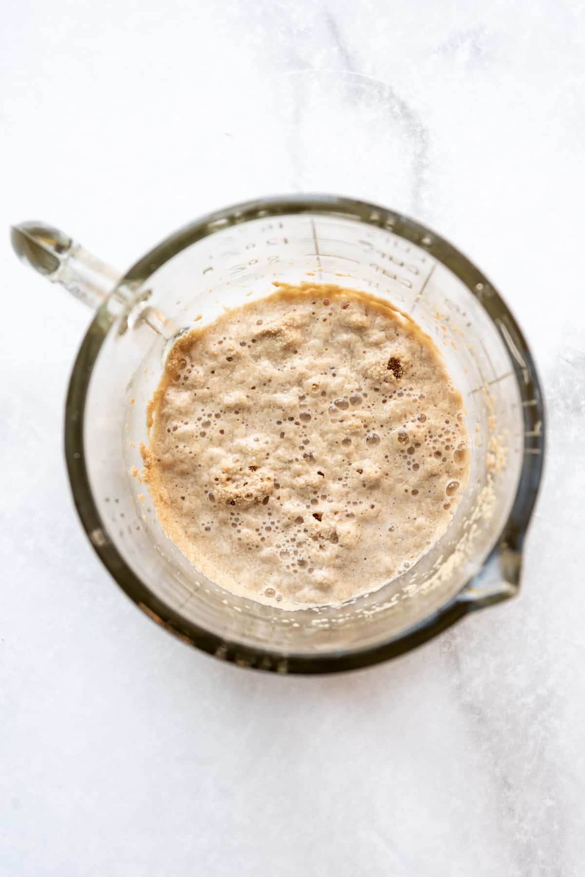 Yeast in a glass bowl with warm water to proof it.