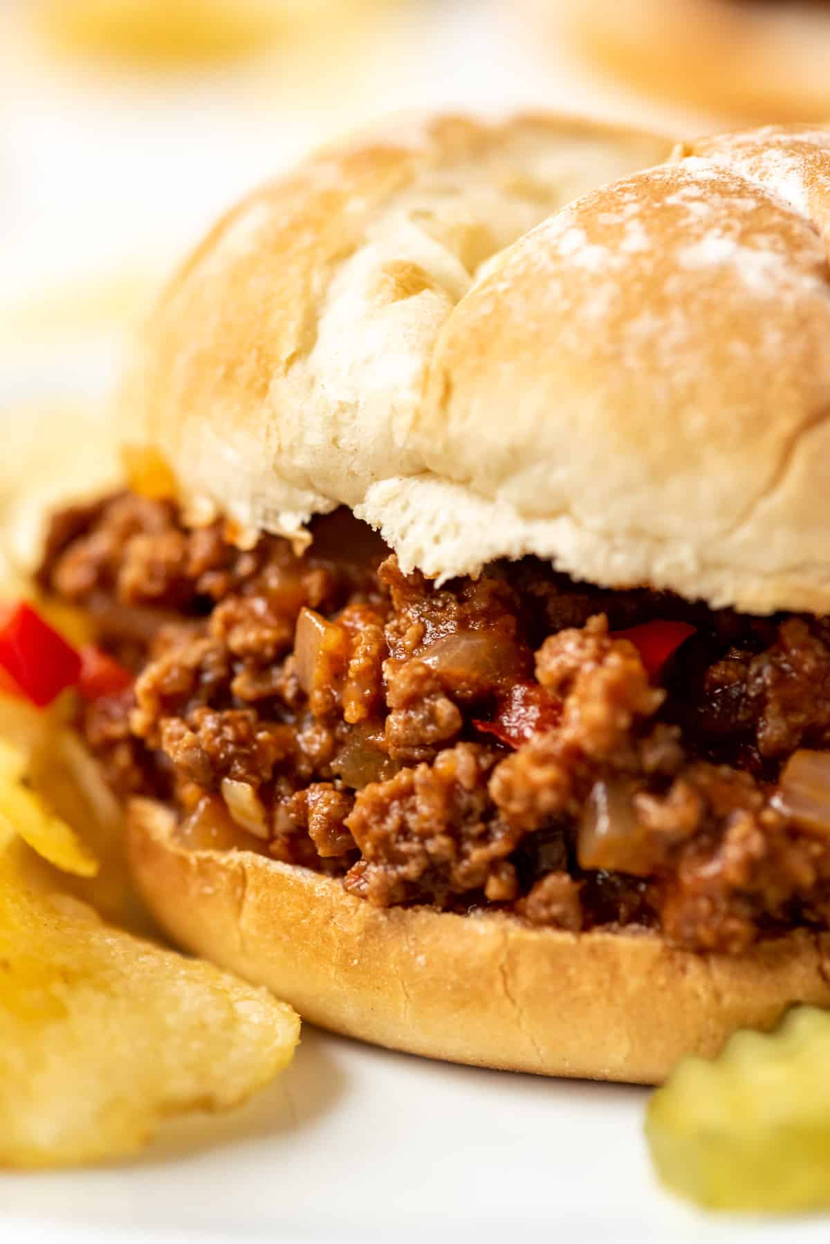 A soft hamburger bun with loose meat in sloppy joe sauce for a quick and easy dinner sandwich.
