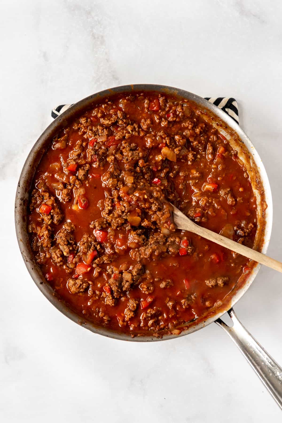 Sloppy Joe sauce simmering in a large skillet.