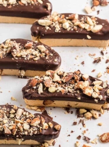 Biscotti cookies dipped in melted semisweet chocolate and sprinkled with chopped toasted almonds.