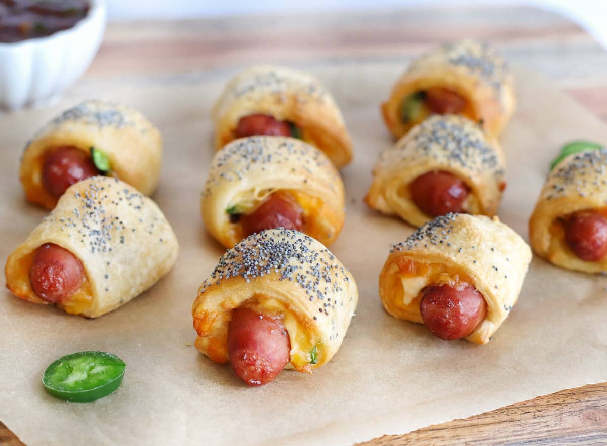 Air fryer pigs in a blanket on parchment paper.