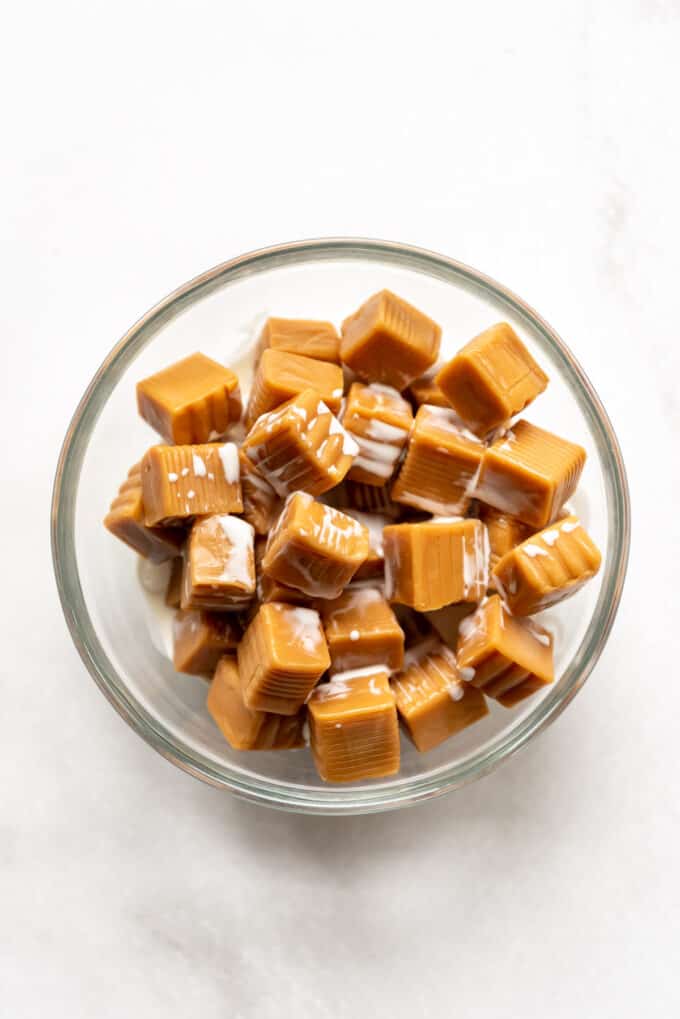 Soft caramels in a bowl with evaporated milk.