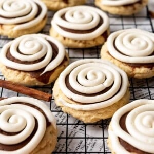 Copycat Crumble cinnamon roll cookies on a wire cooling rack.