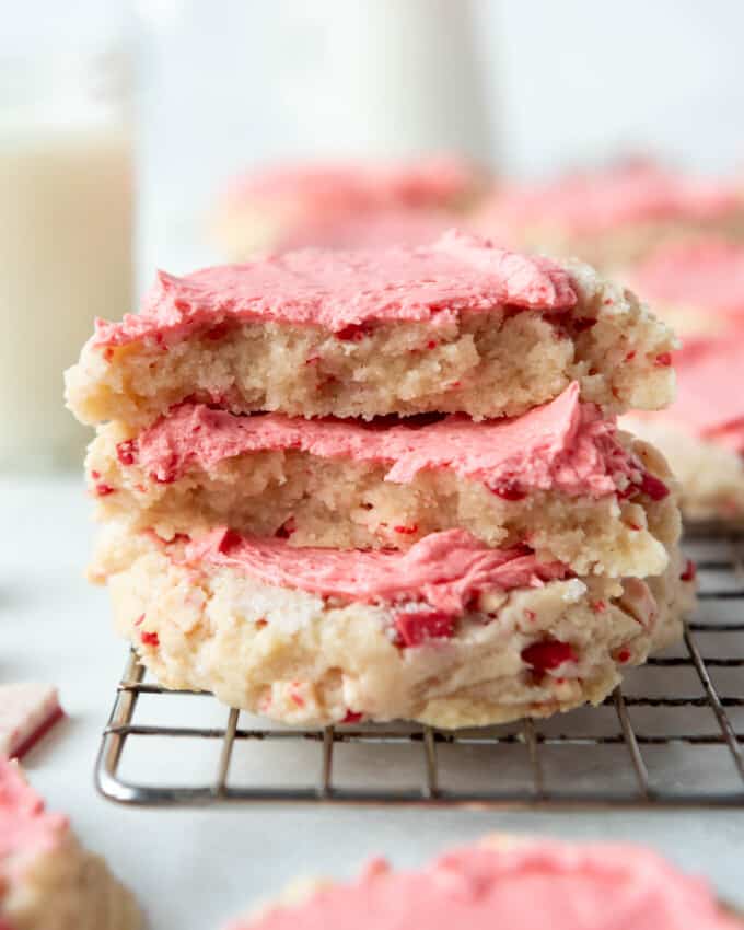 An image of peppermint swig sugar cookies stacked on top of each other.