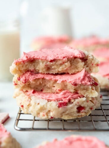 An image of peppermint swig sugar cookies stacked on top of each other.