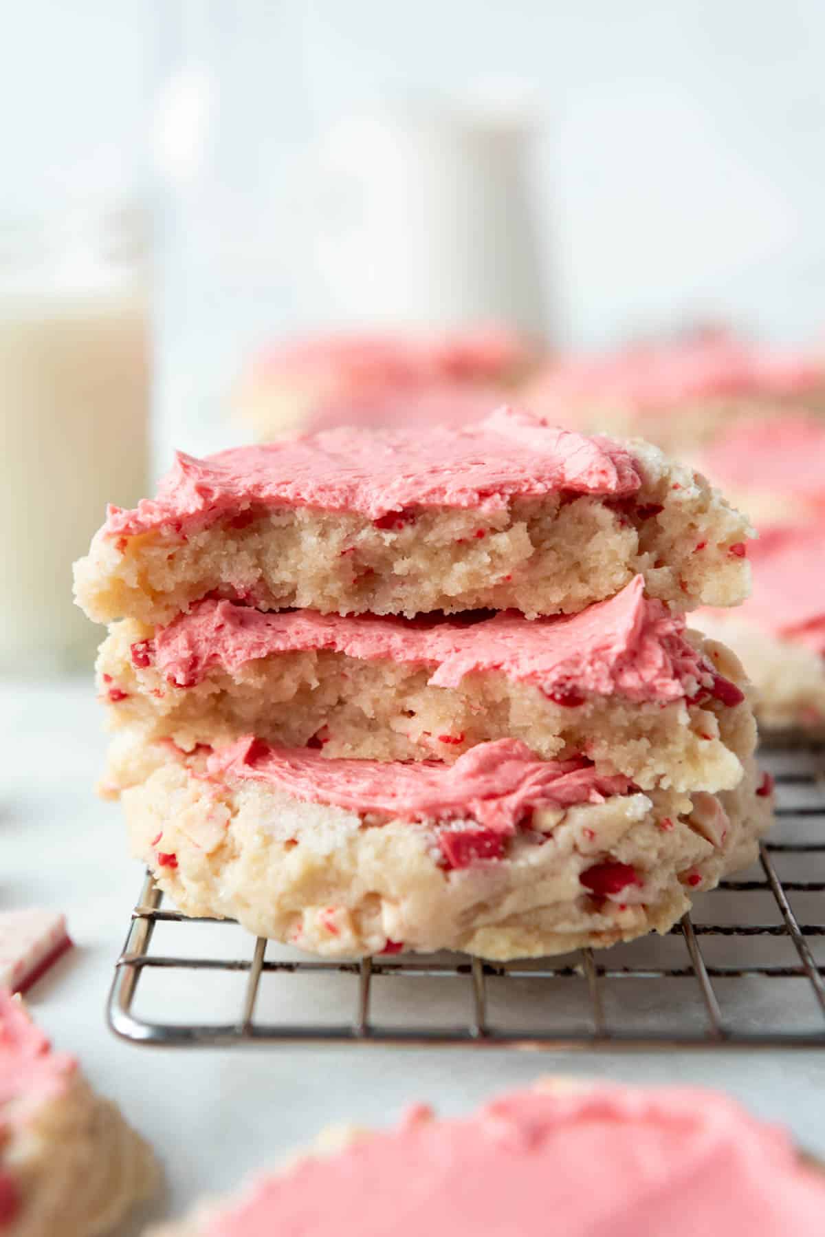 An image of peppermint swig sugar cookies stacked on top of each other.