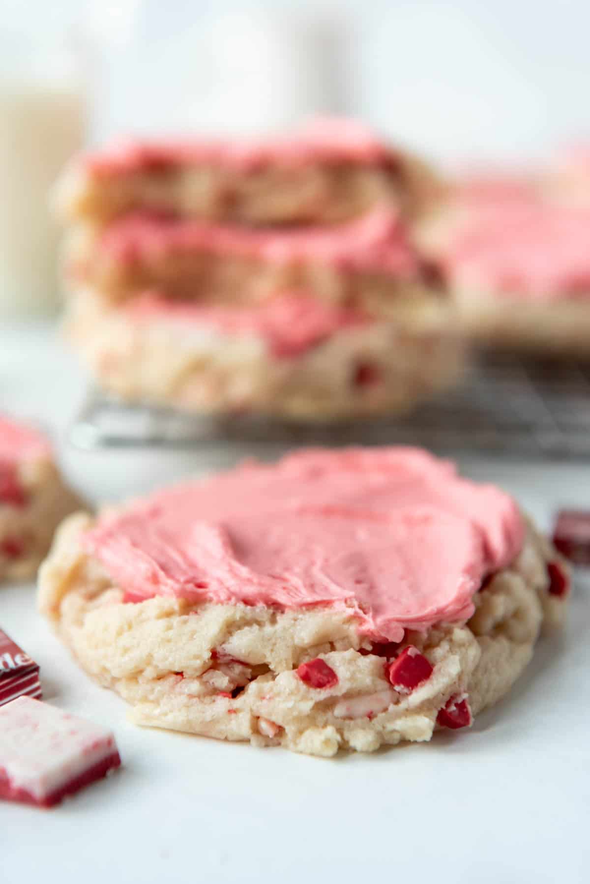 A thick peppermint sugar cookie with pink frosting.