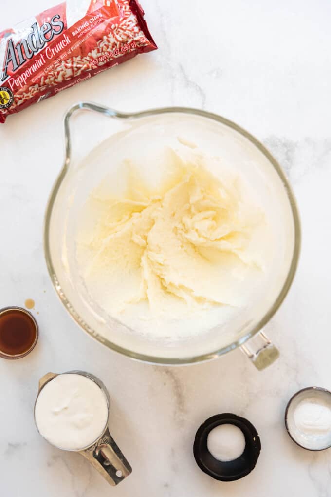 Creamed butter, sugar, and oil in a large glass mixing bowl.