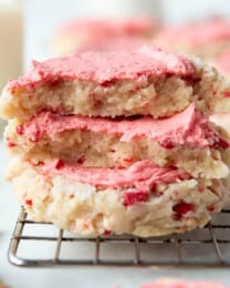 An image of peppermint swig sugar cookies stacked on top of each other.