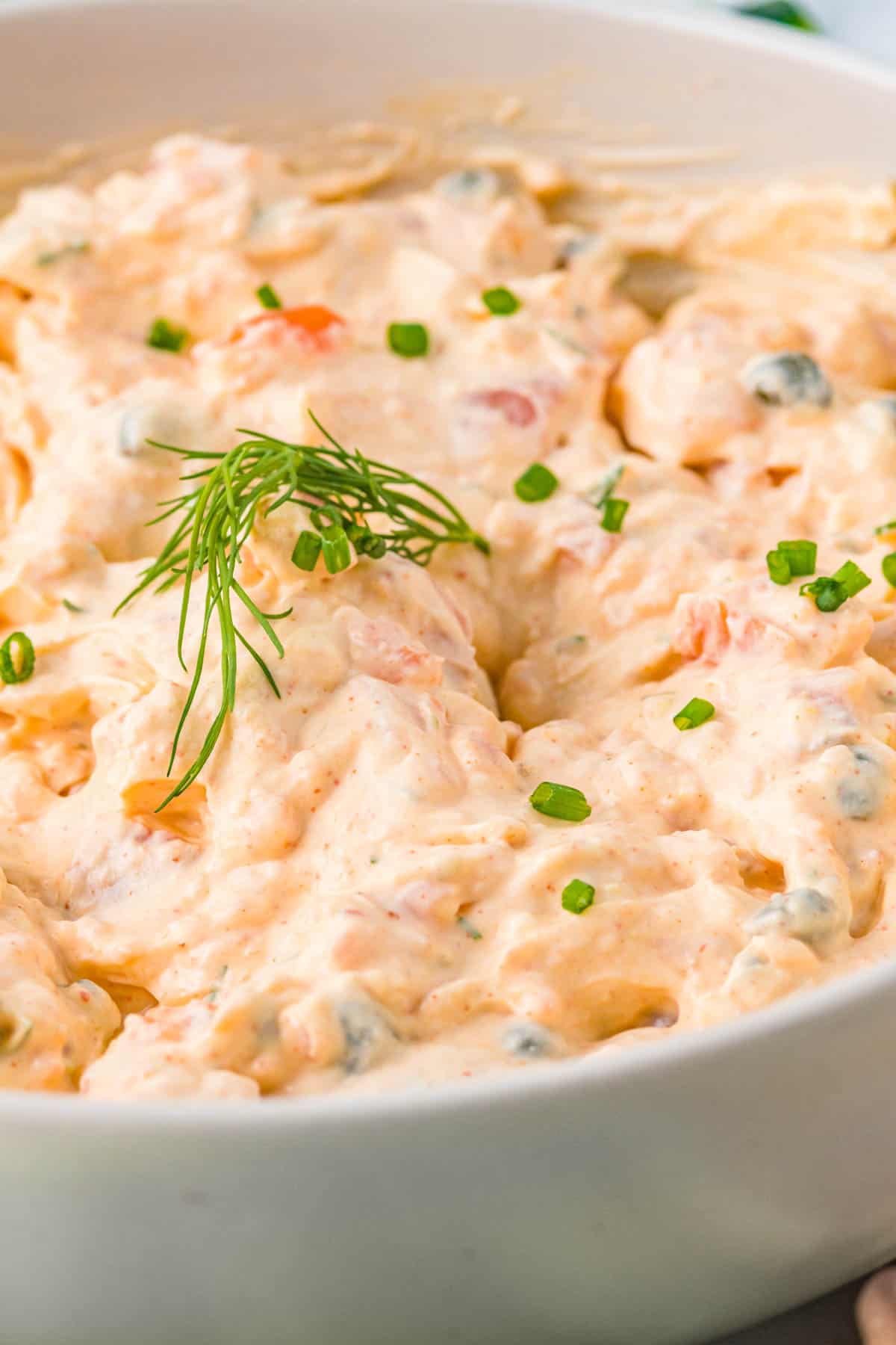 Close up of smoked salmon dip in a white bowl. 