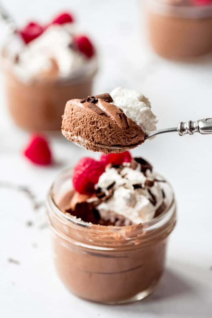 A spoonful of chocolate French mousse dessert.