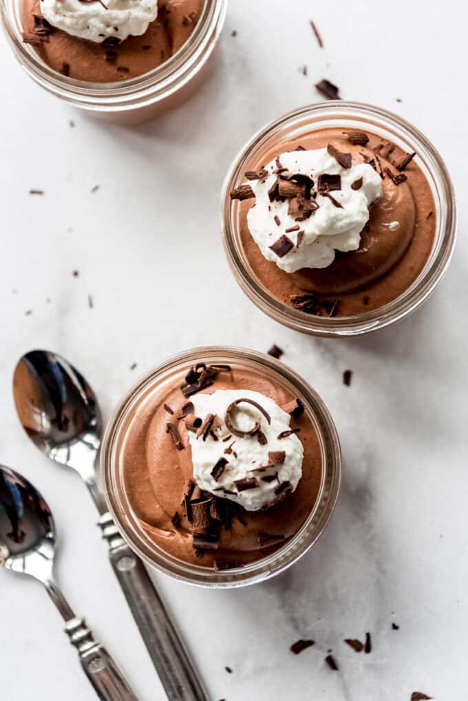 Overhead desserts with whipped cream and chocolate curls.
