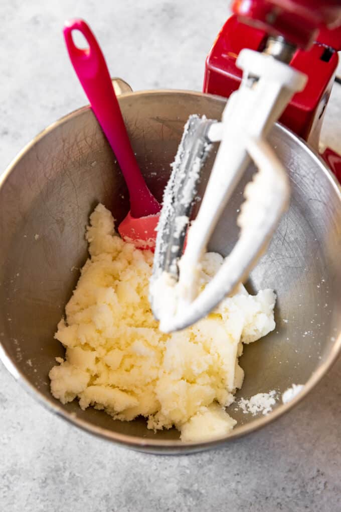 An image of butter and sugar being creamed together to make a homemade red velvet cake from scratch.
