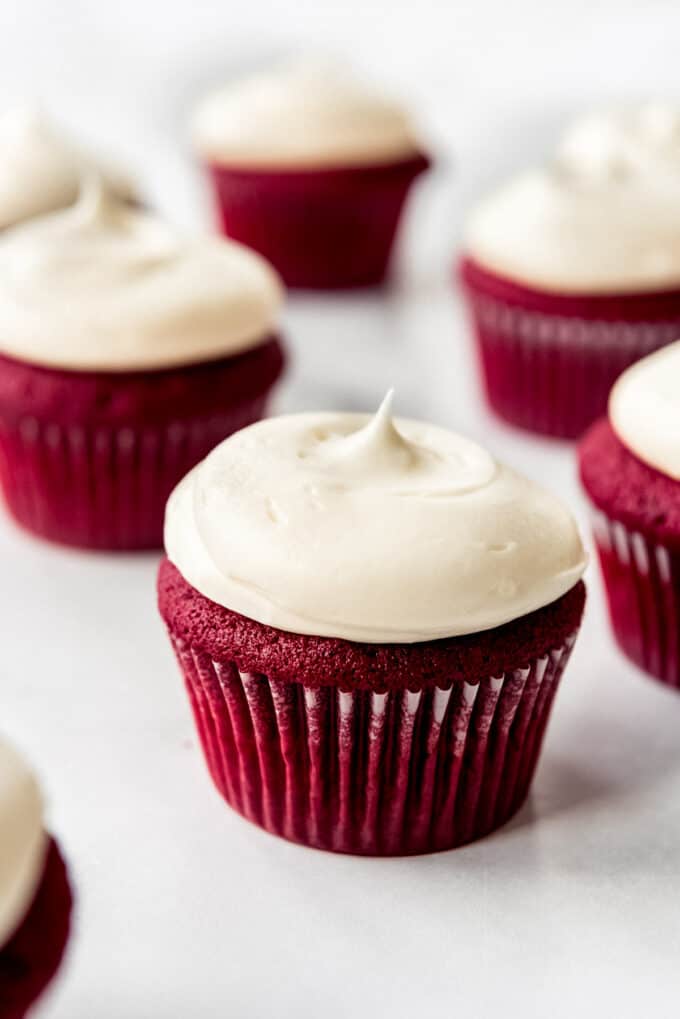 Red velvet cupcakes topped with generous dollops of homemade cream cheese frosting.