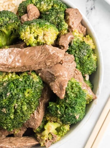 A close image of tender pieces of beef and broccoli.