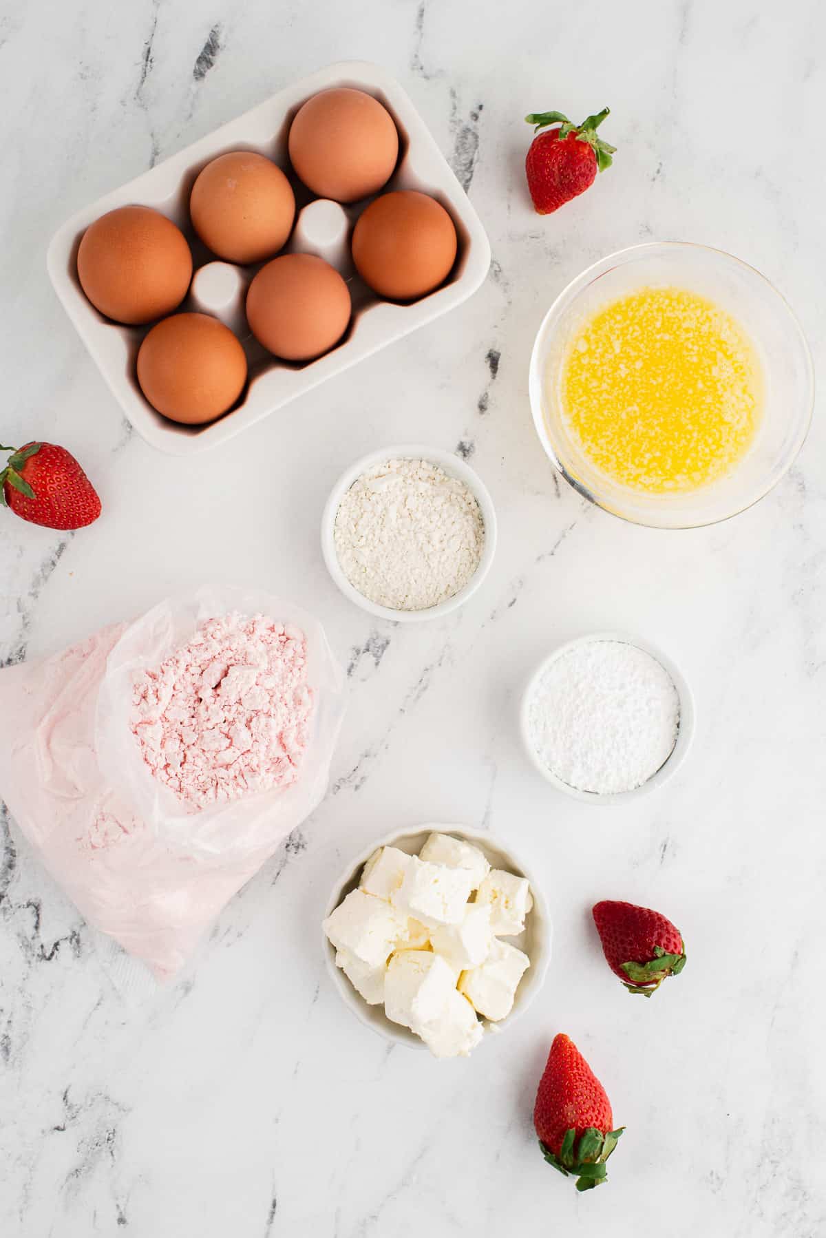 Ingredients for making cheesecake stuffed strawberry cheesecake cookies.