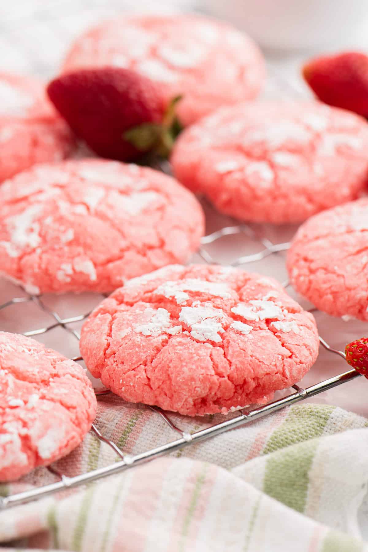 Strawberry cake mix cookies cooling on a wire cooling rack.