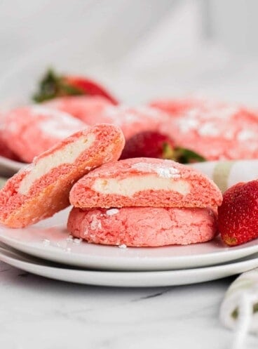 Cheesecake stuffed strawberry cake mix cookies on a white plate.